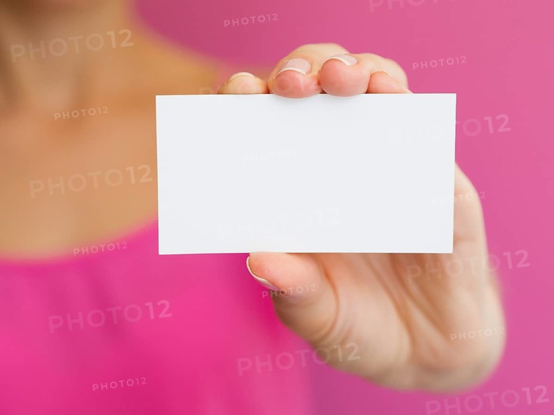 Close up woman with pink shirt white card