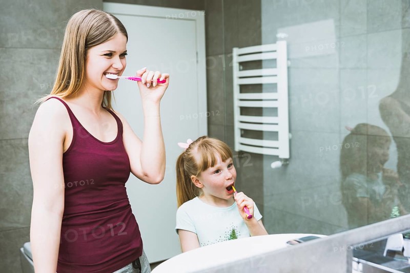 Cute woman girl brushing teeth