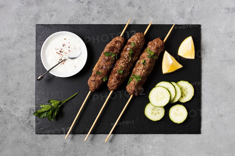 Delicious arabic fast food skewers slices cucumber