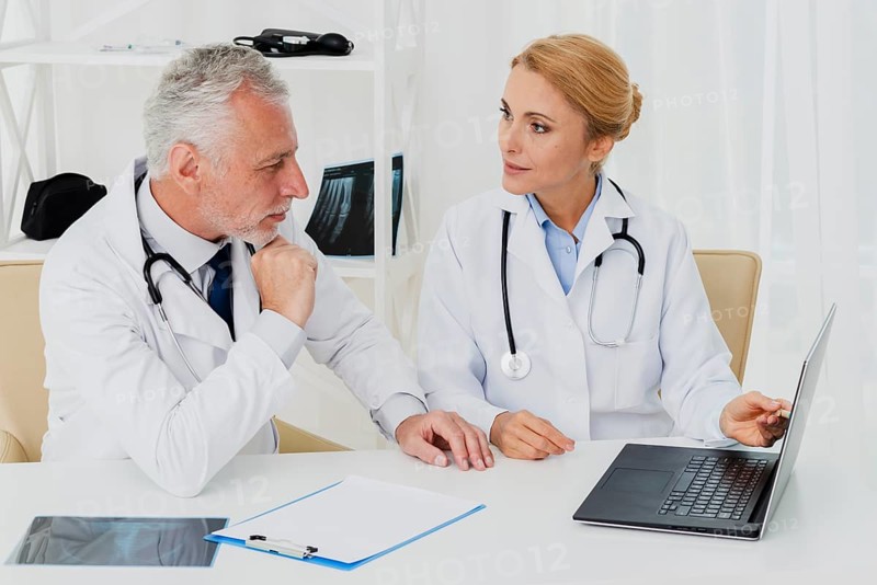 Doctors doing research laptop