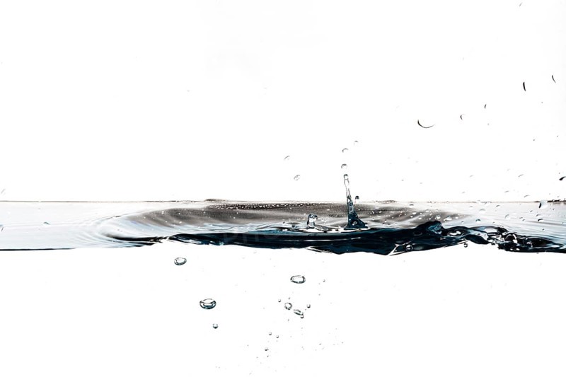 Drops dripping water surface
