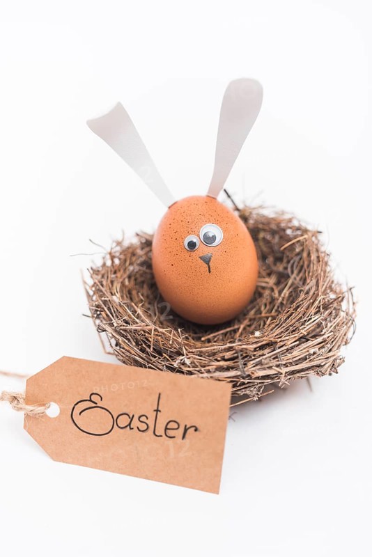 Easter inscription with egg with bunny ears nest