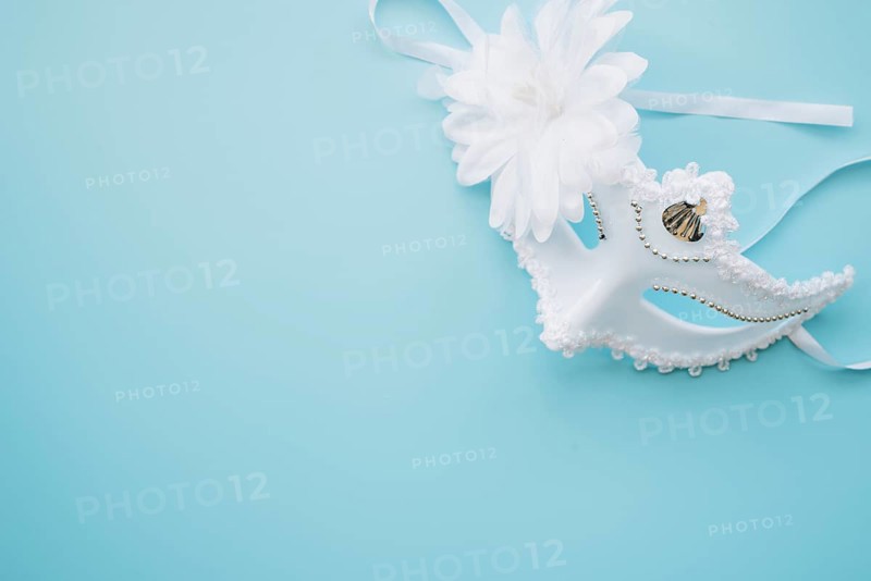 Elegant white mask blue background