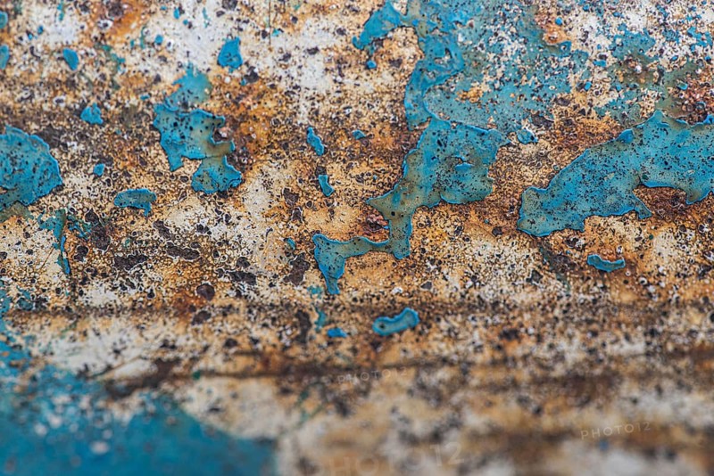 Flat lay rusty metal surface with paint peel