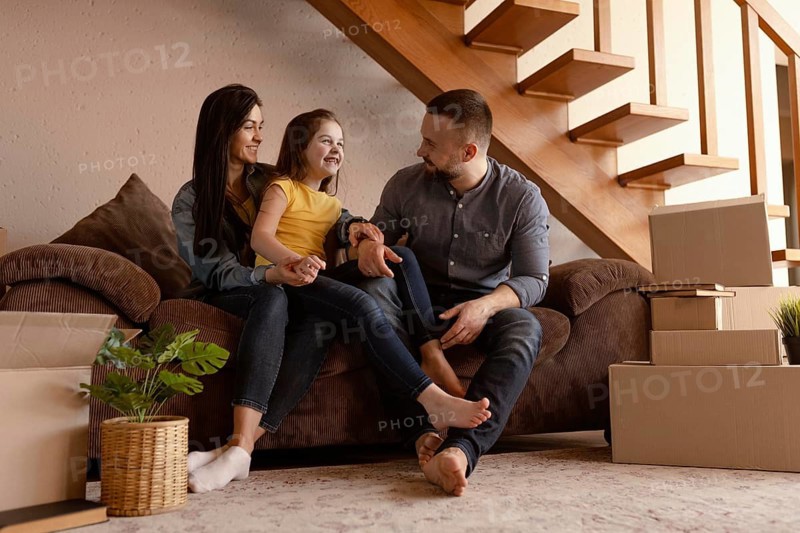 Full shot parents kid couch