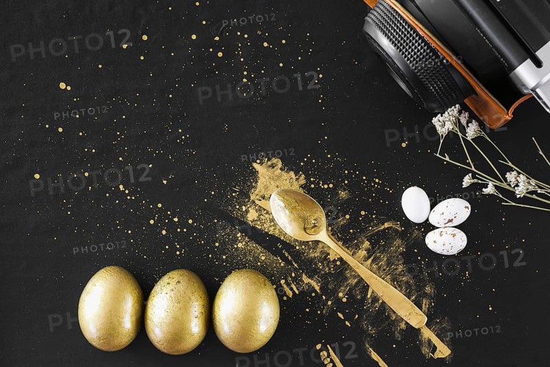 Golden eggs near spoon camera
