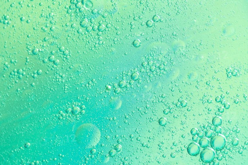 Green airy water bubbles glowing drops