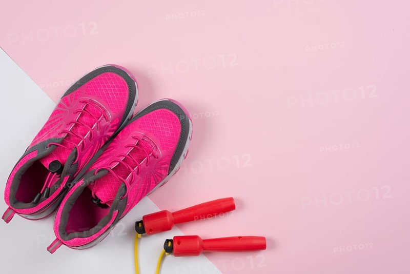Lovely sport composition with skipping rope trainers