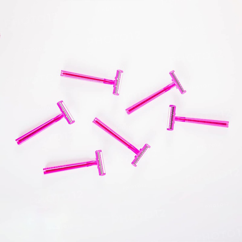 Pink female razors white background