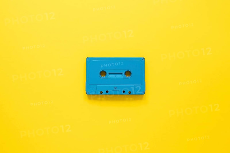 Radio concept with cassette yellow background