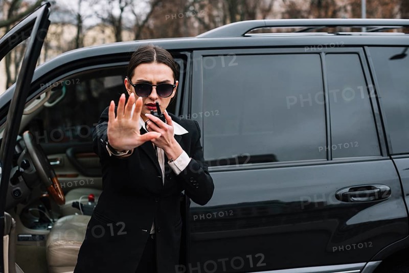 Security female protecting client
