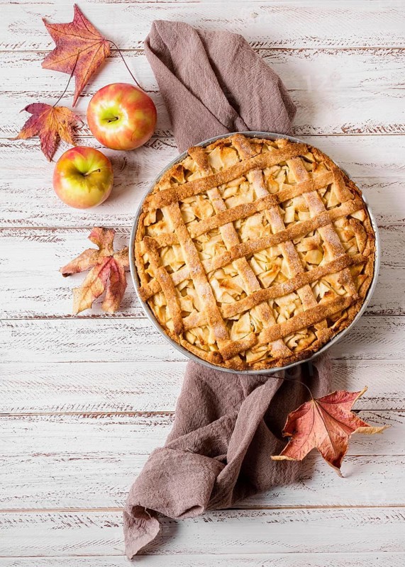 Top view apple pie thanksgiving with autumn leaves