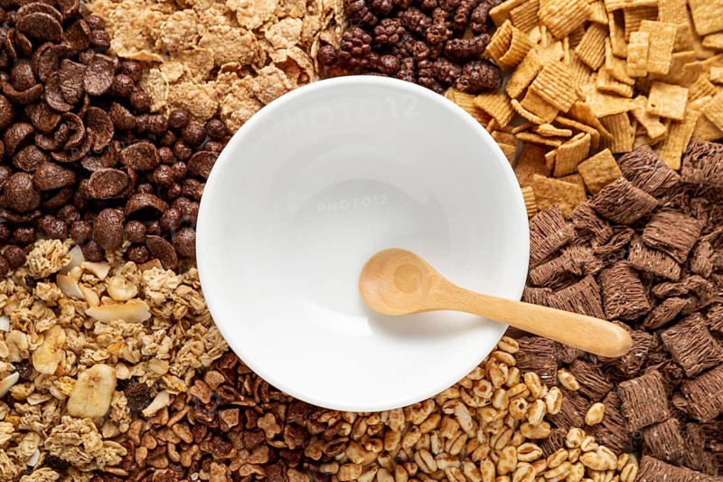 Top view assortment breakfast cereals with empty bowl