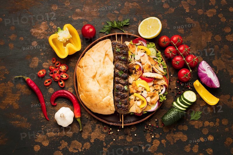 Top view assortment delicious kebabs with vegetables
