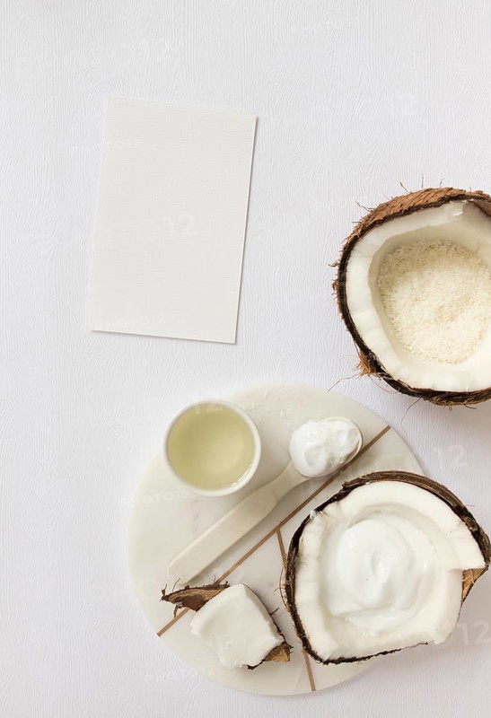 Top view cosmetic with coconut blank card white surface