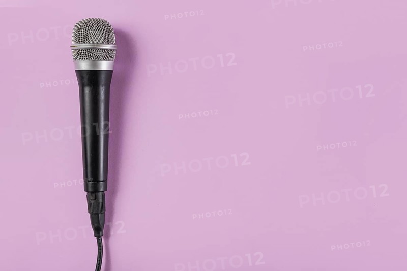 Top view microphone pink background