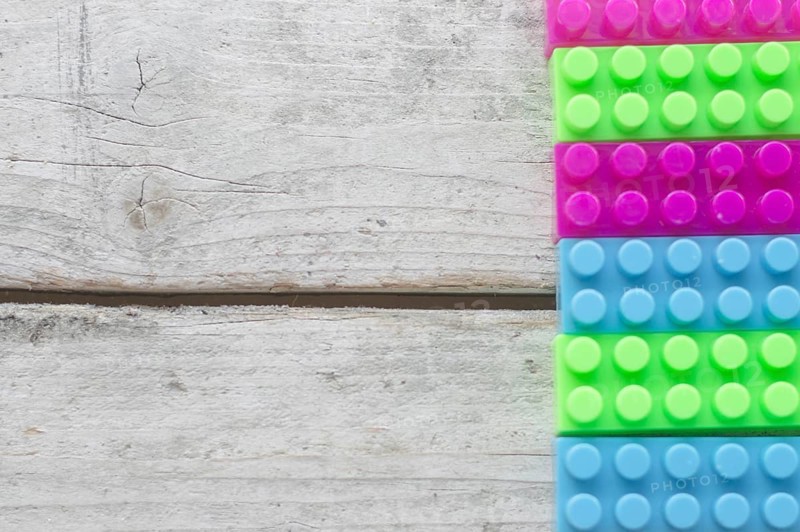 Toy bricks wooden surface