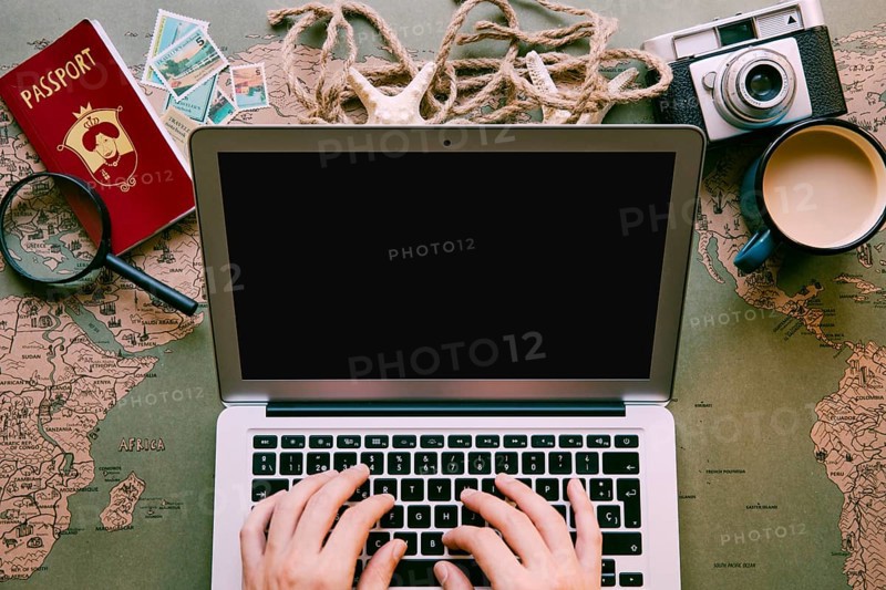 Traveller typing laptop