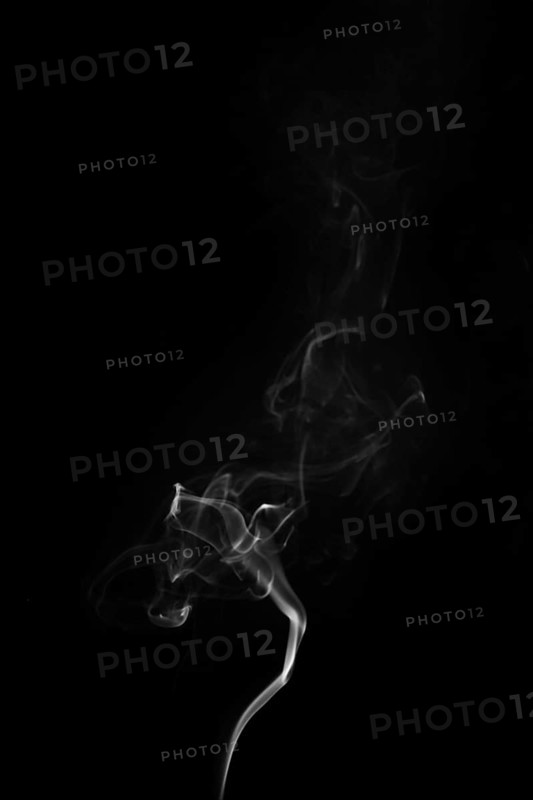 White smoke swirling around black background