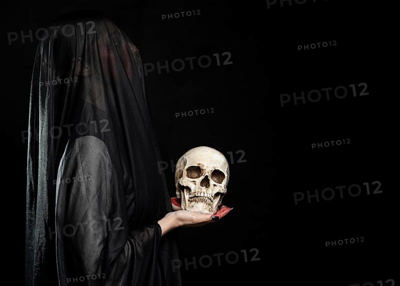 Woman with black veil copy space