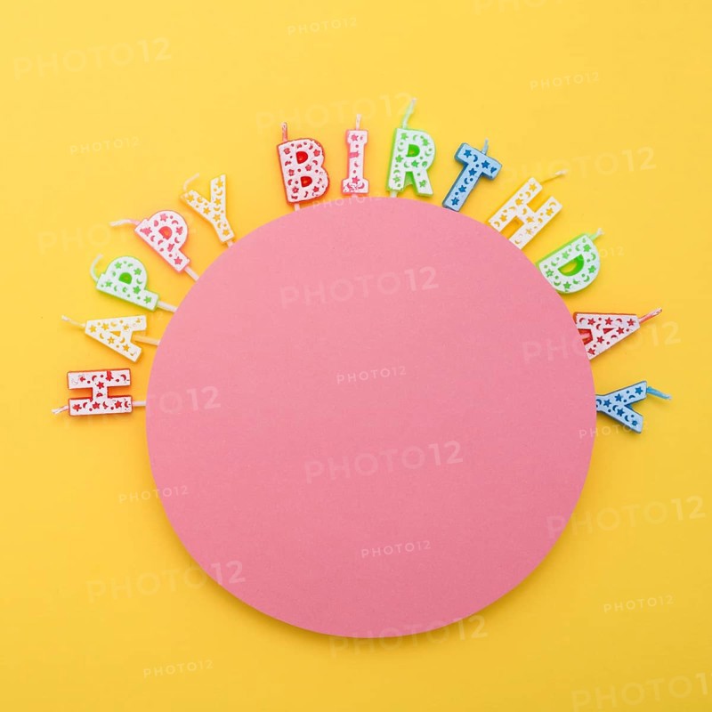 Circle unlit birthday candles with letters