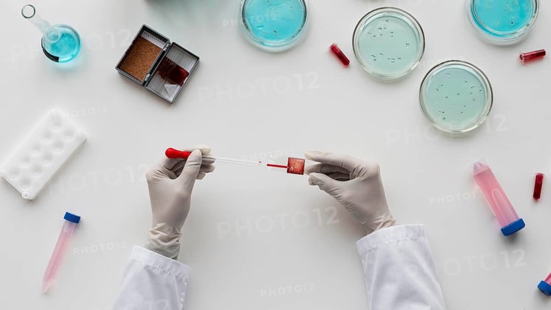 Close up hands holding pipette