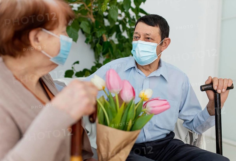 Close up man woman wearing masks
