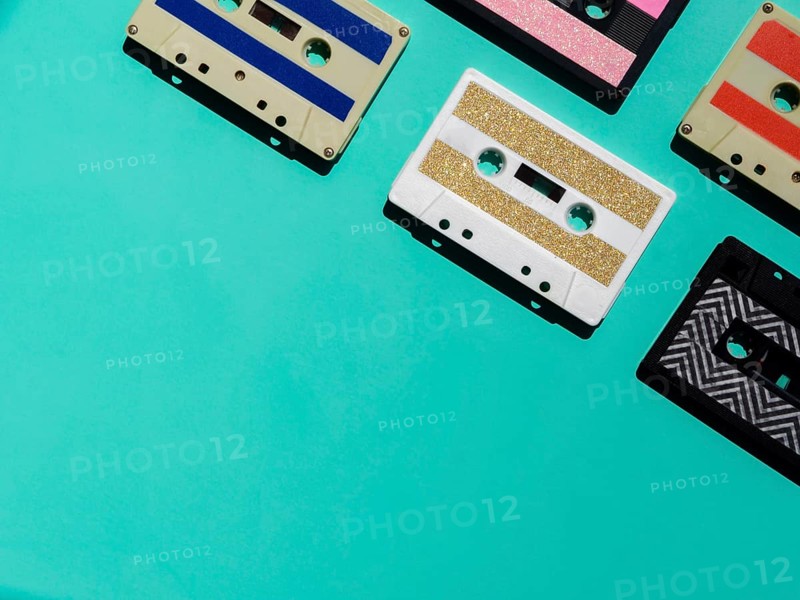 Colorful cassette tapes corner with copy space