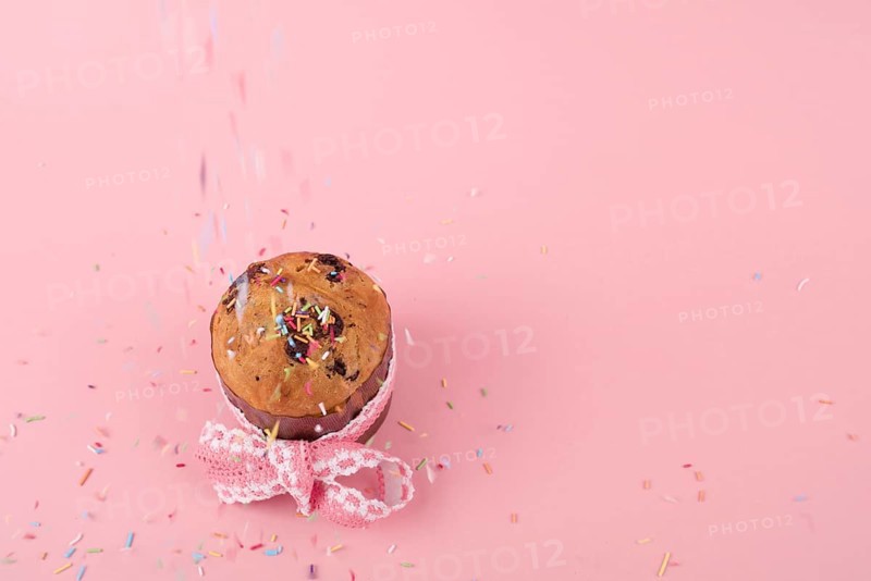 Colorful sprinkles falling easter cake