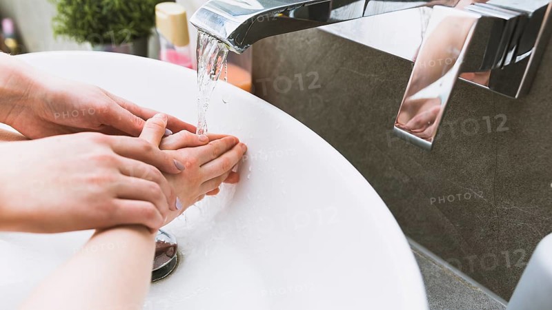 Crop hands water stream