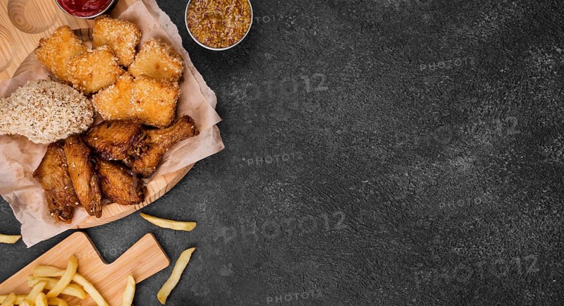 Flat lay fried chicken with french fries copy space