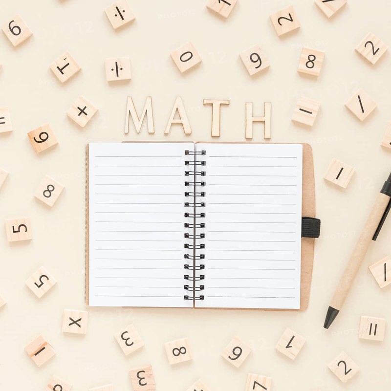 Flat lay math science scrabble board numbers with notebook