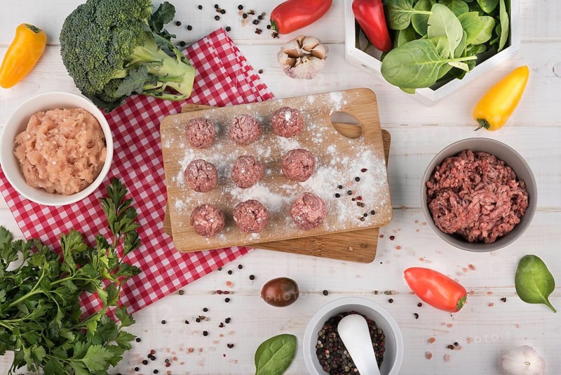 Flat lay meatballs wooden board minced meat broccoli