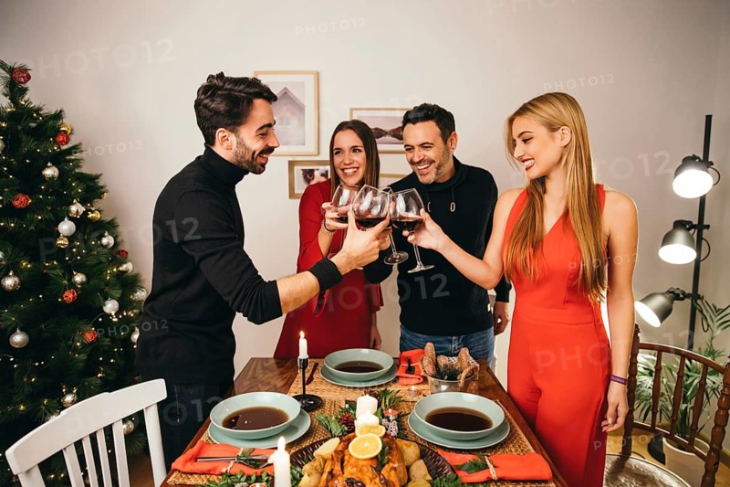 Four friends dining christmas