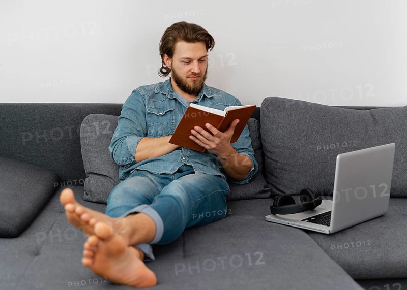 Full shot man reading book