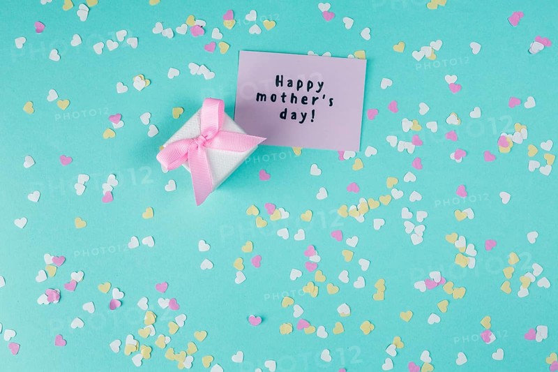 Happy mothers day inscription with small gift box