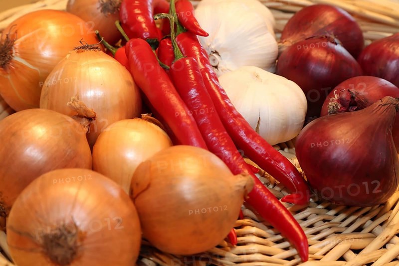 A woven basket filled with red chilli peppers