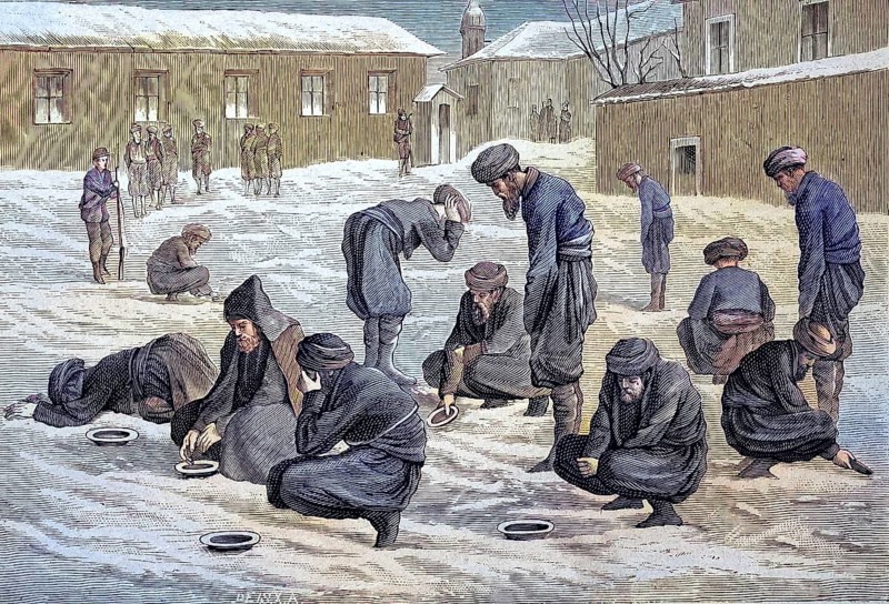 Turkish prisoners in Russia perform their ablutions and prayers in the snow-covered courtyard