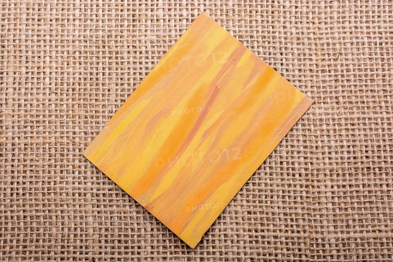 Piece of painted note paper on a linen canvas