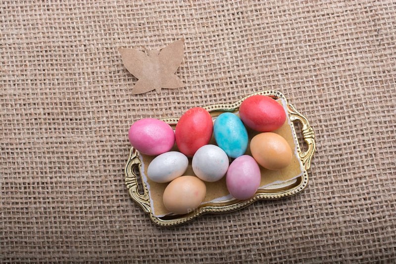 Paper Butterfly on Colorful candy sweets in tray