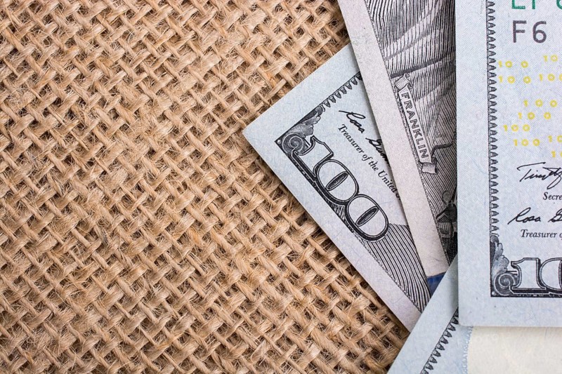 Banknote of US dollar placed on a linen canvas
