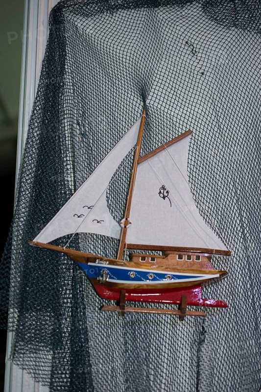 Mini size little colorful model sailboat in view