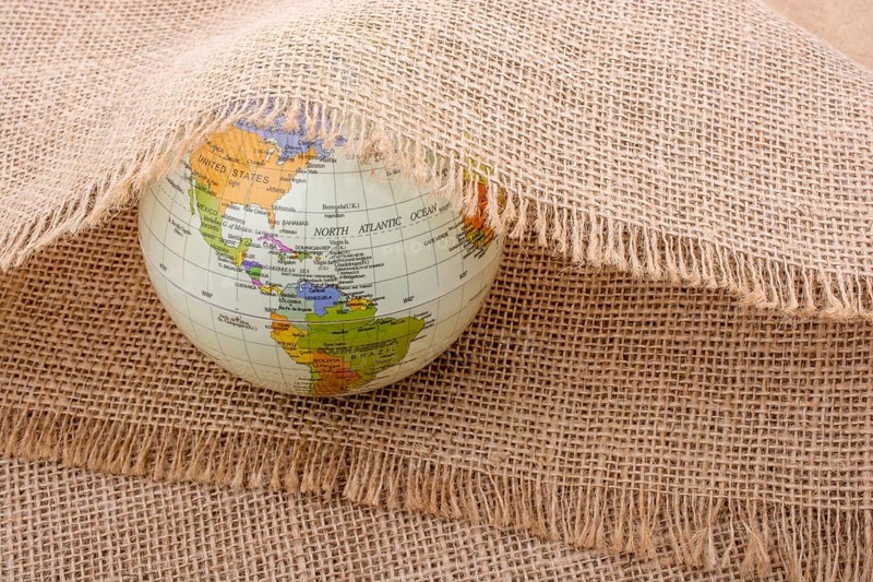 Model globe placed under a linen canvas