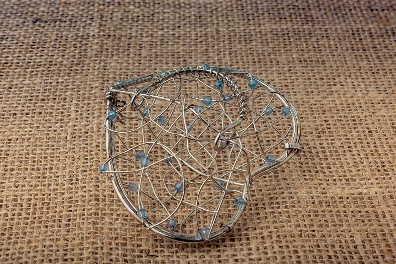 Heart shaped placed cage on linen canvas