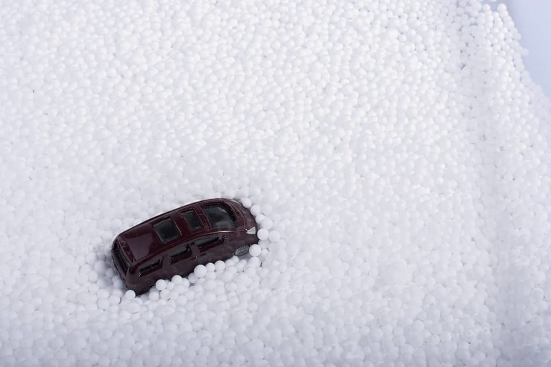Model car on little white polystyrene foam balls