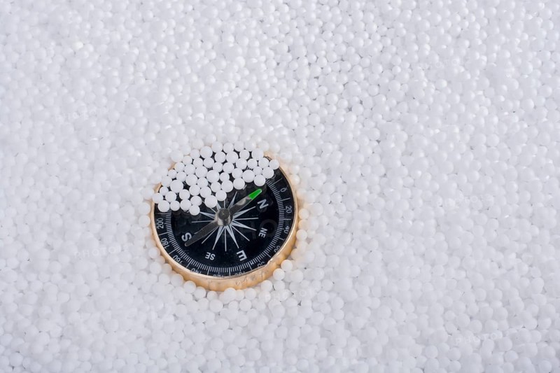 Compass on little white polystyrene foam balls