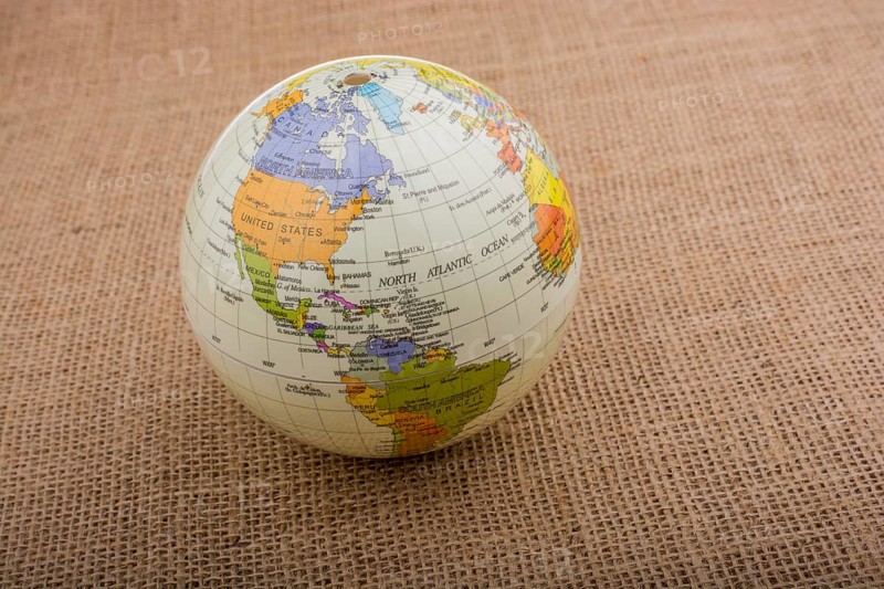 Globe placed on a brown fabric background