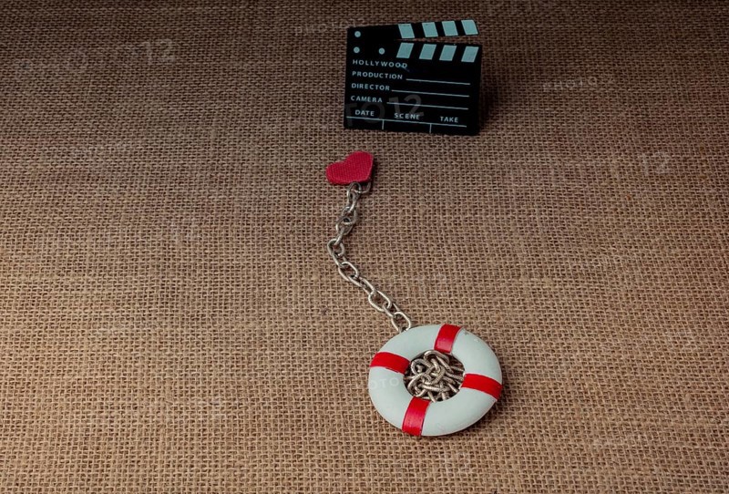 Heart attached to a life preserver and a cinema clapper