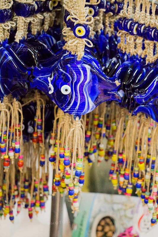 Evil eye bead as Amulet souvenir in the shape of fish from Turkey