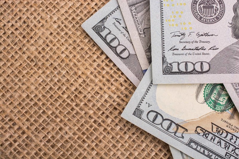 Banknote of US dollar placed on a linen canvas